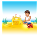 Boy Playing in Sand with a sand castle and a red bucket