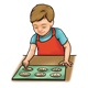 Boy Baking cookies on cookie sheet