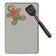 Gingerbread Boy  with spatula on cookie sheet