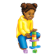 Girl in yellow shirt playing with blocks